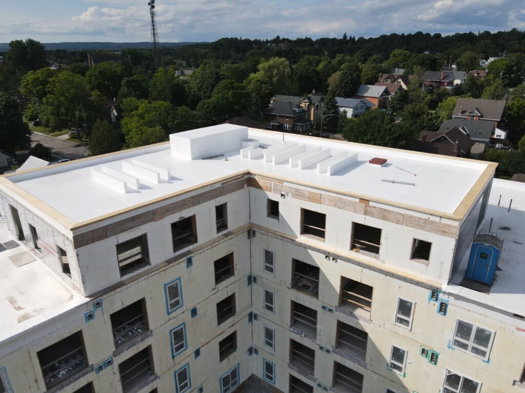 PVC flat roof installation on residential building — OYH Roofing