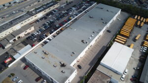 Modified bitumen flat roof installation on commercial building — OYH Roofing