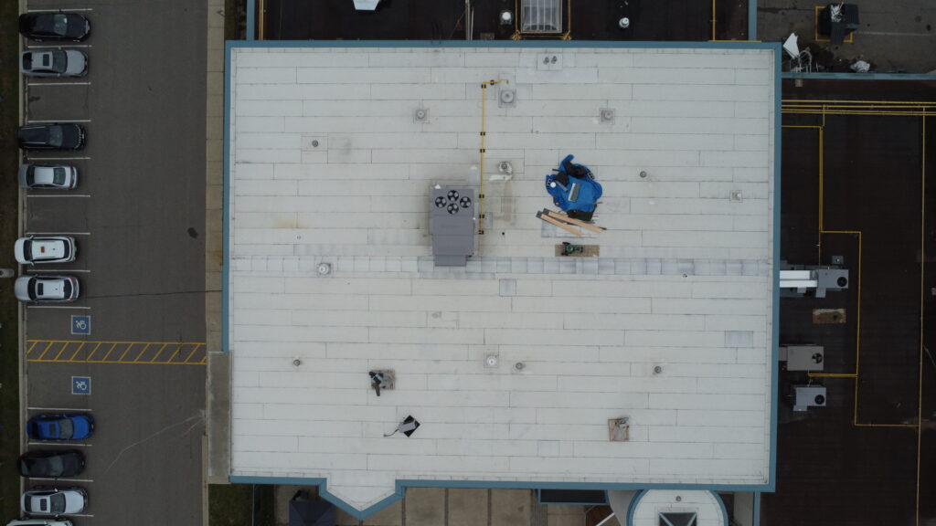 Top-down drone view of 8500 sqft modified bitumen roof at 3185 Mavis Rd Mississauga commercial roofing project