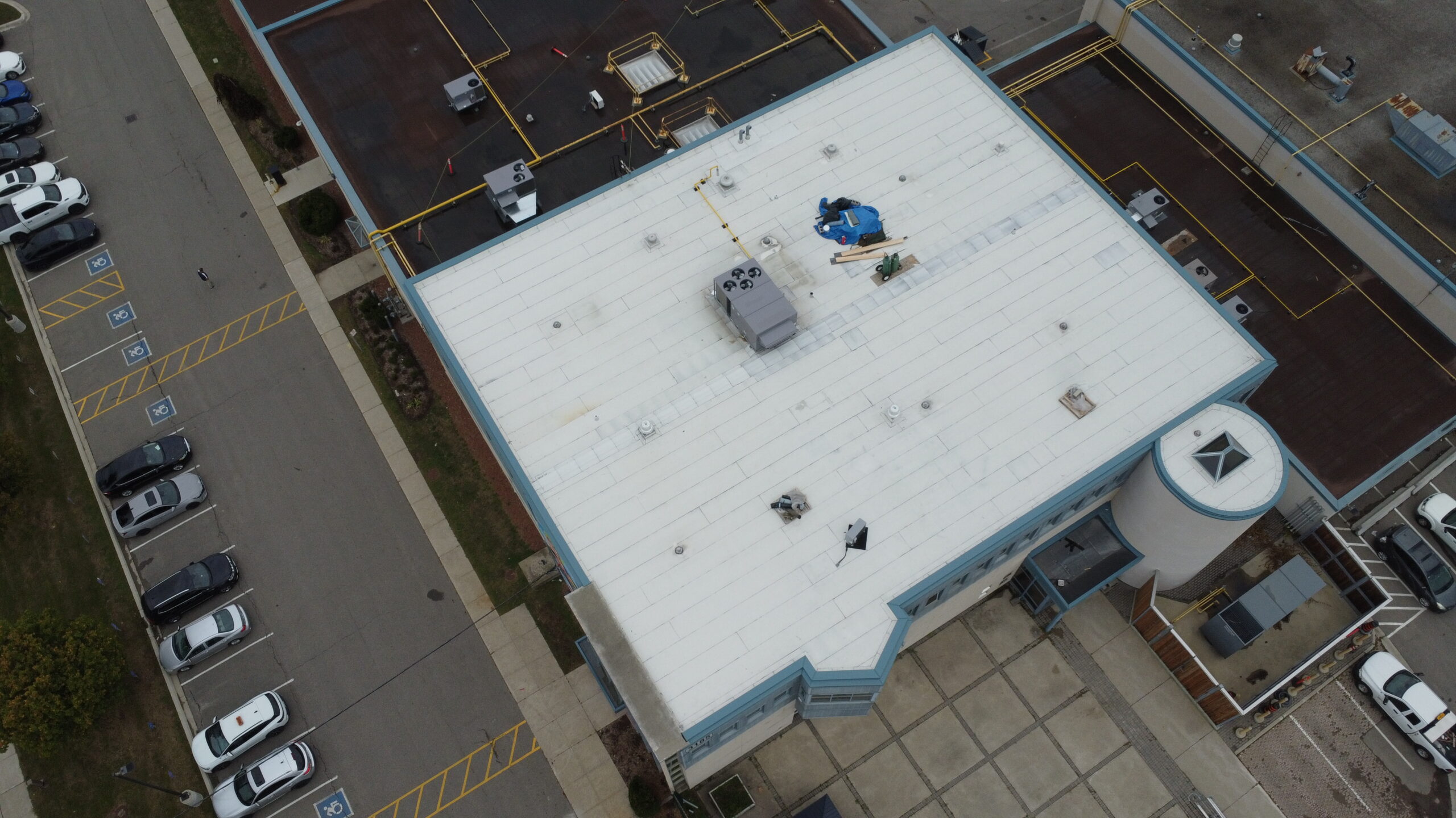 High-angle drone view of 3185 Mavis Rd showing full 8500 sqft modified bitumen roof installed for Mississauga commercial project