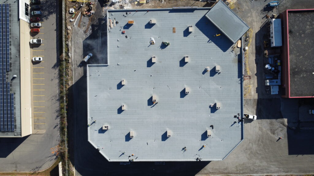 Top-down drone view of 52300 sqft modified bitumen roof in Welland Ontario commercial roofing project