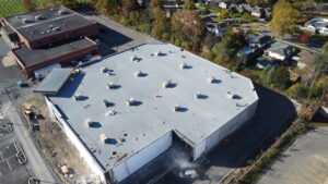 High angle drone shot of modified bitumen roof installation at 777 Niagara St Welland 52300 sqft commercial roof